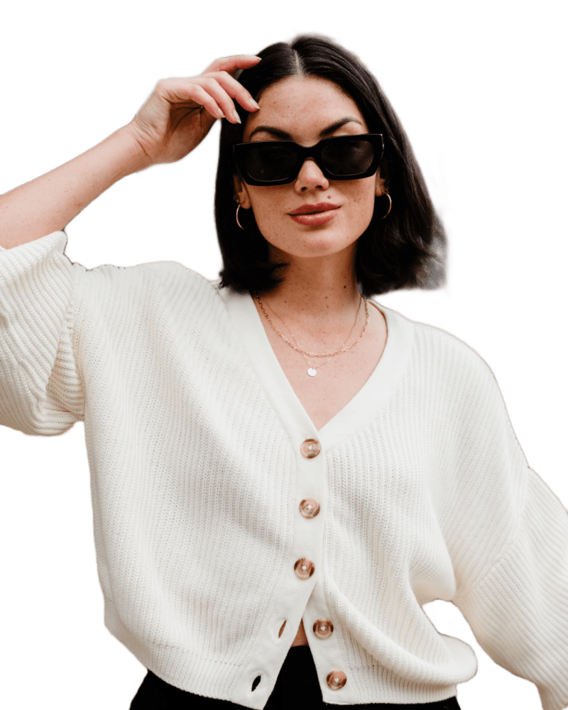 Front of a model wearing a size XL Marlene Cropped Cardigan in Antique White by ABLE. | dia_product_style_image_id:316042